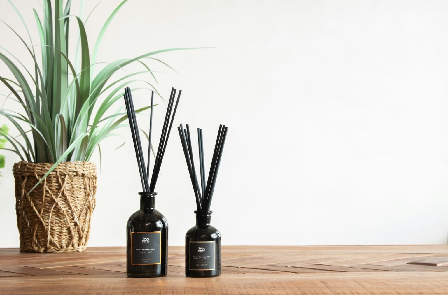 Bottle of oil next to a plant