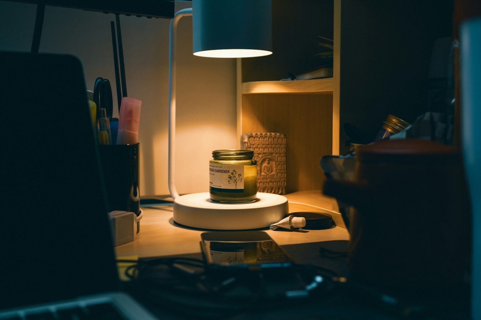 Candles vs candle warmers vs diffusers – Lamp shining on a candle jar on a desk