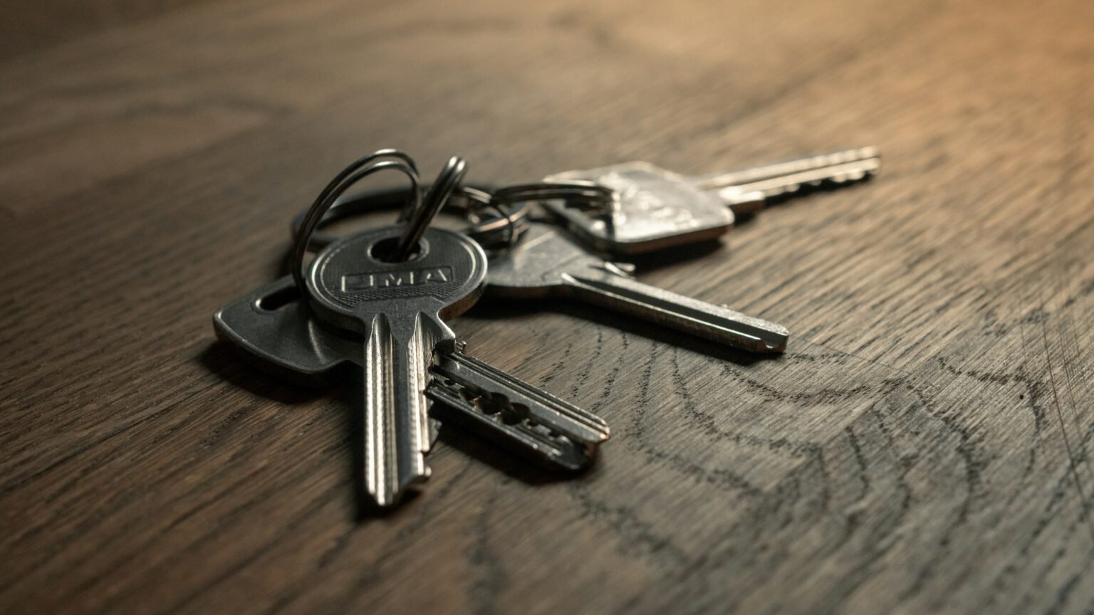 Bunch of keys on a wooden table