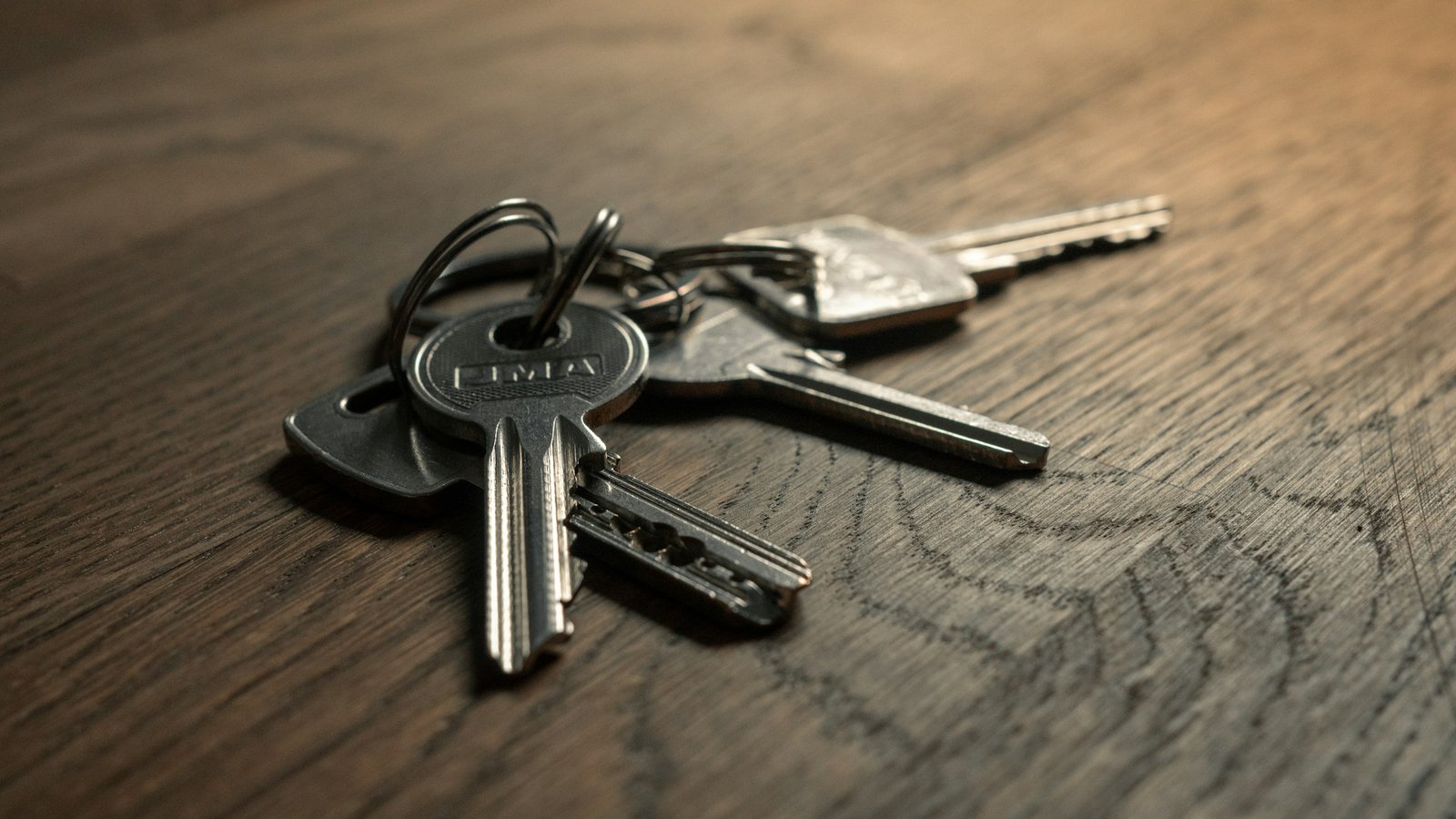Bunch of keys on a wooden table