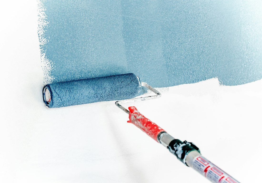 Paint roller on a wall