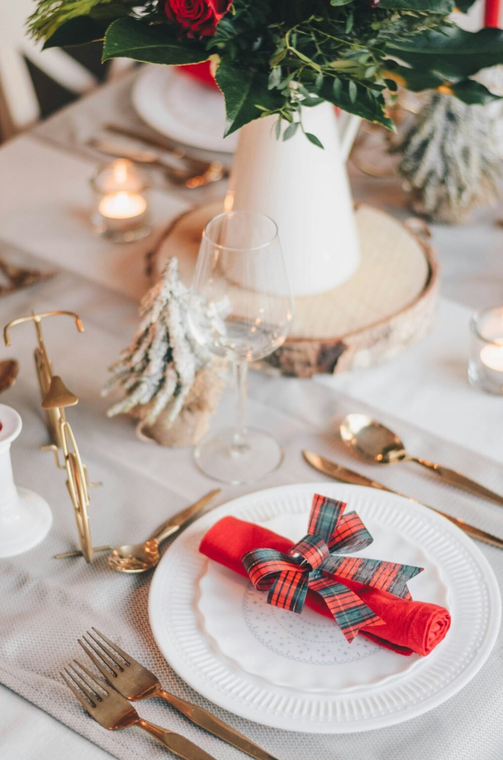 Red and white ribbon on a gold tray