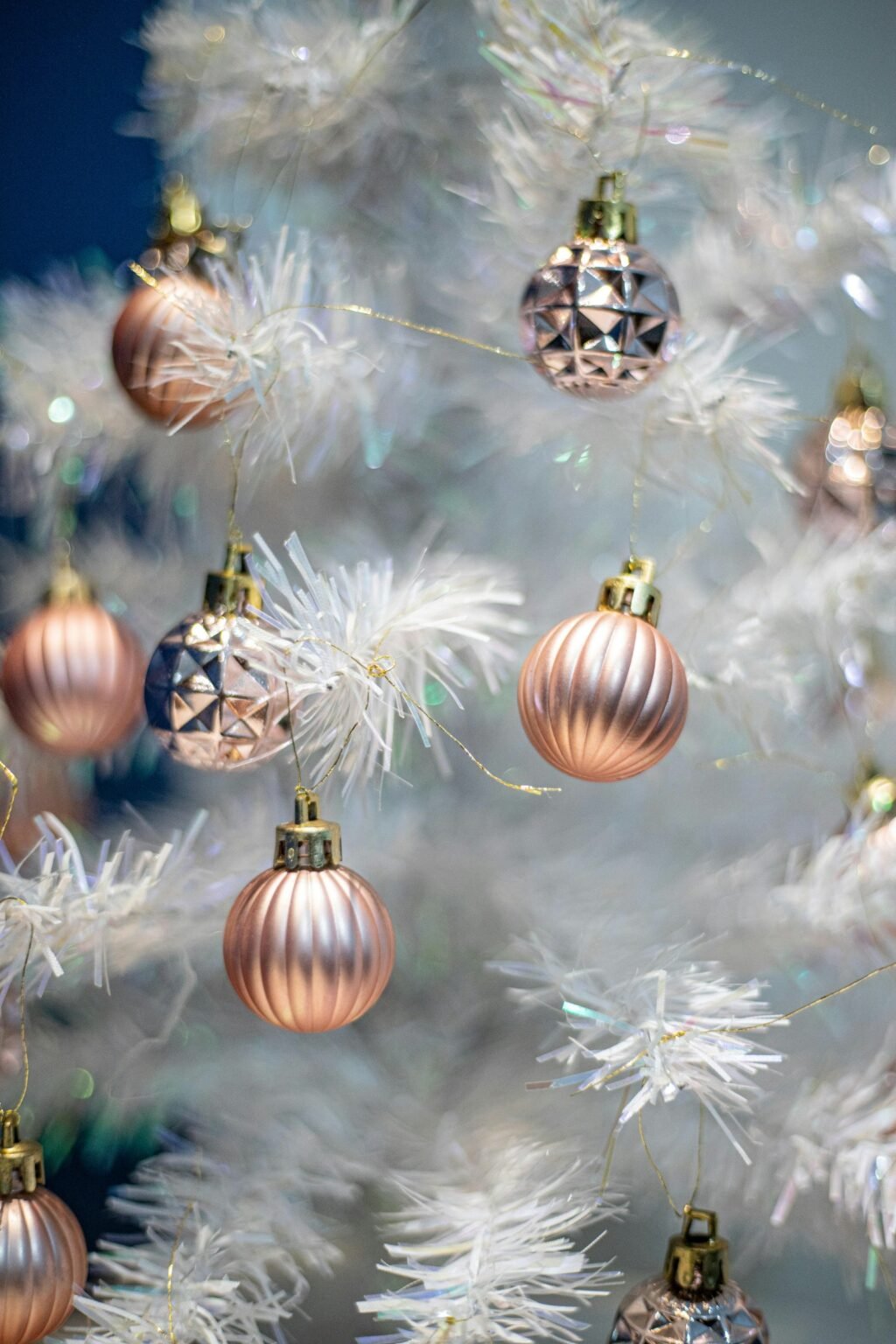 Christmas tree theme ideas – Gold and silver ornaments on a white Christmas tree