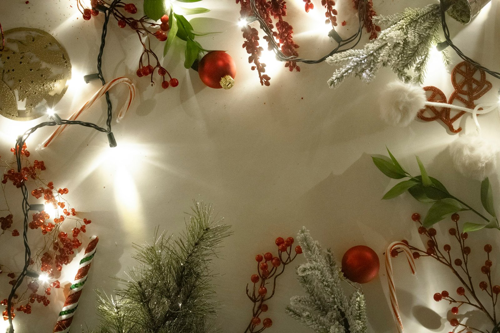 White table with Christmas decorations and lights