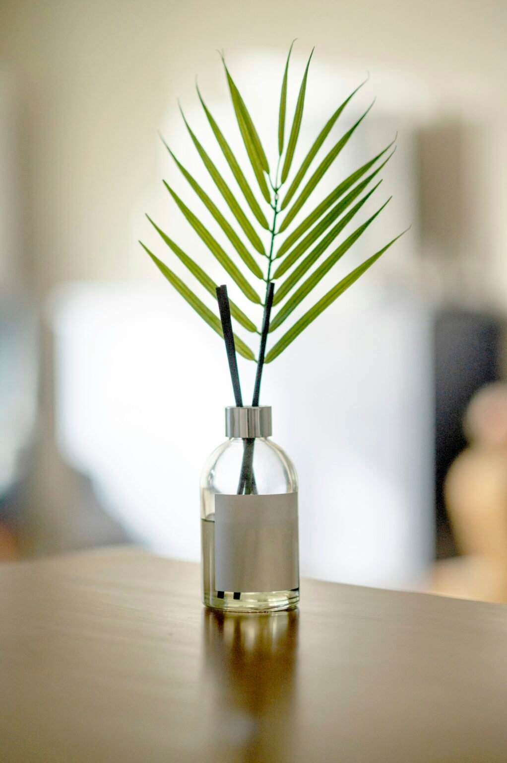 Green plant in a clear glass bottle