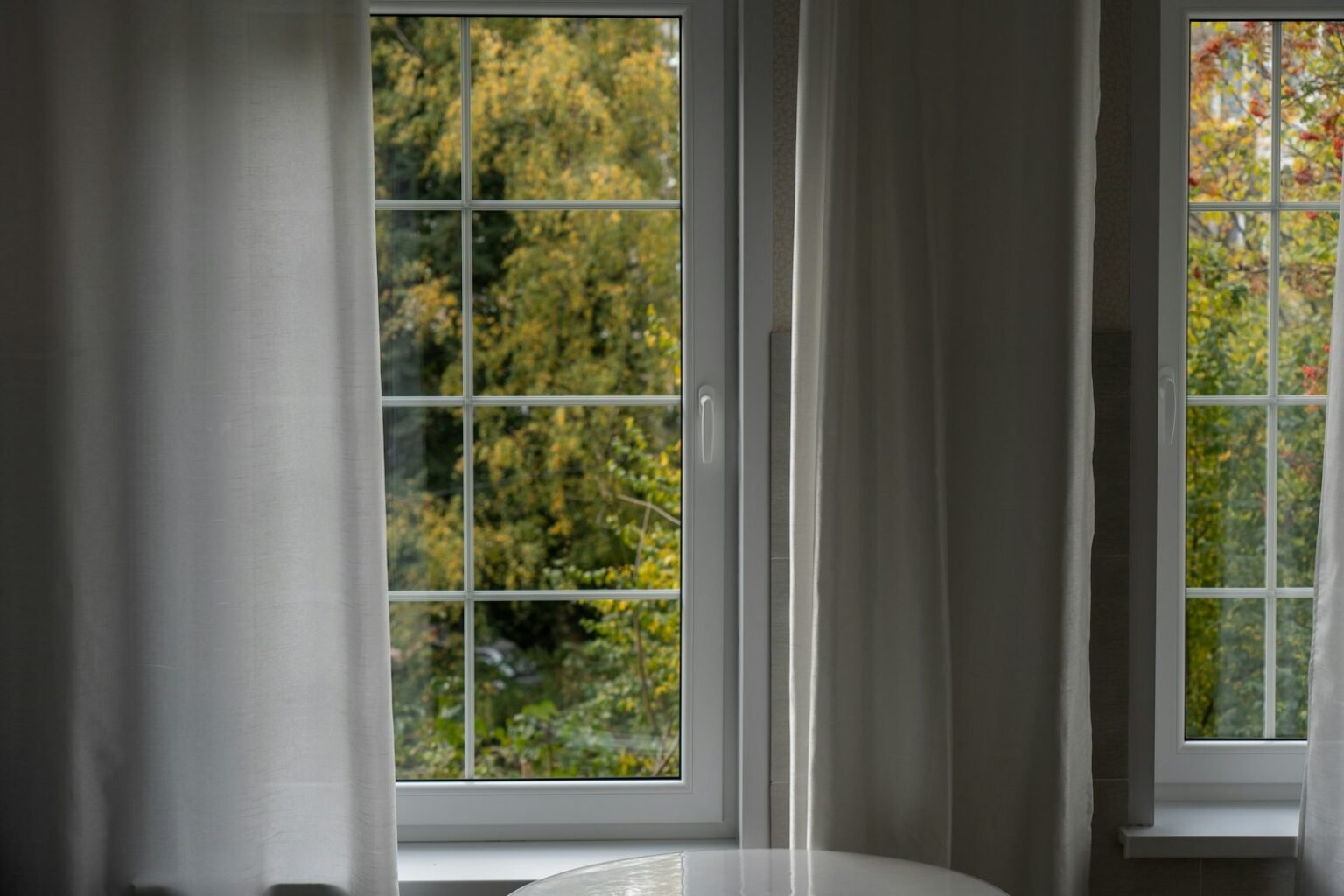 White table in front of two windows