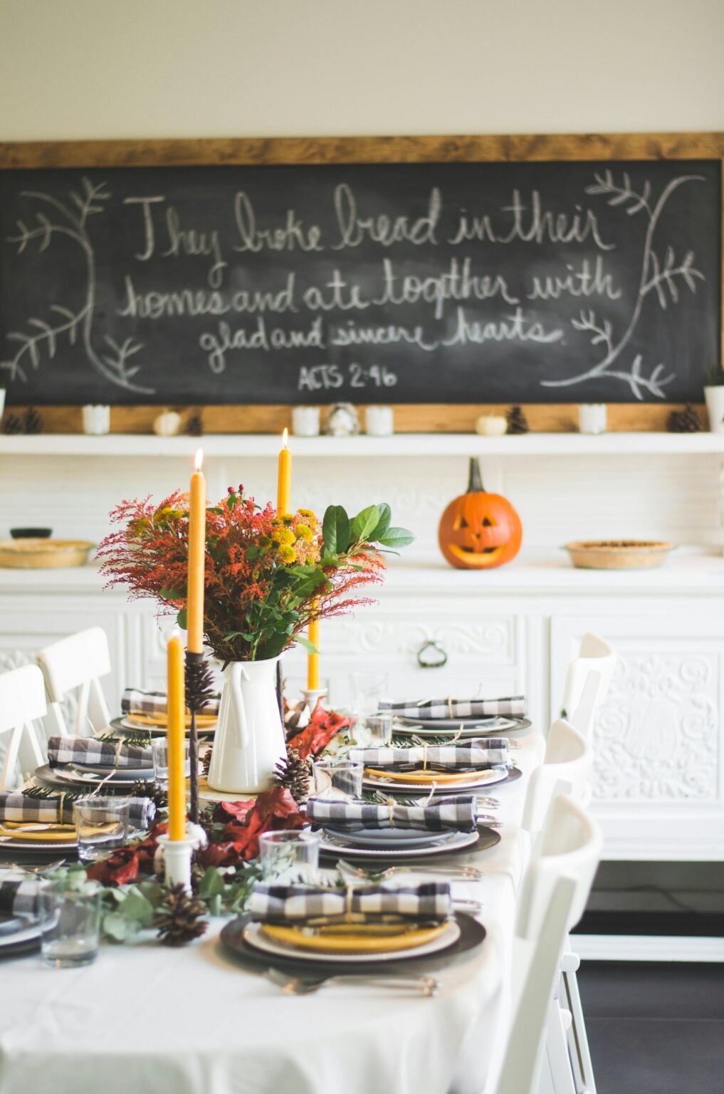 Candles and pumpkins on a fall table
