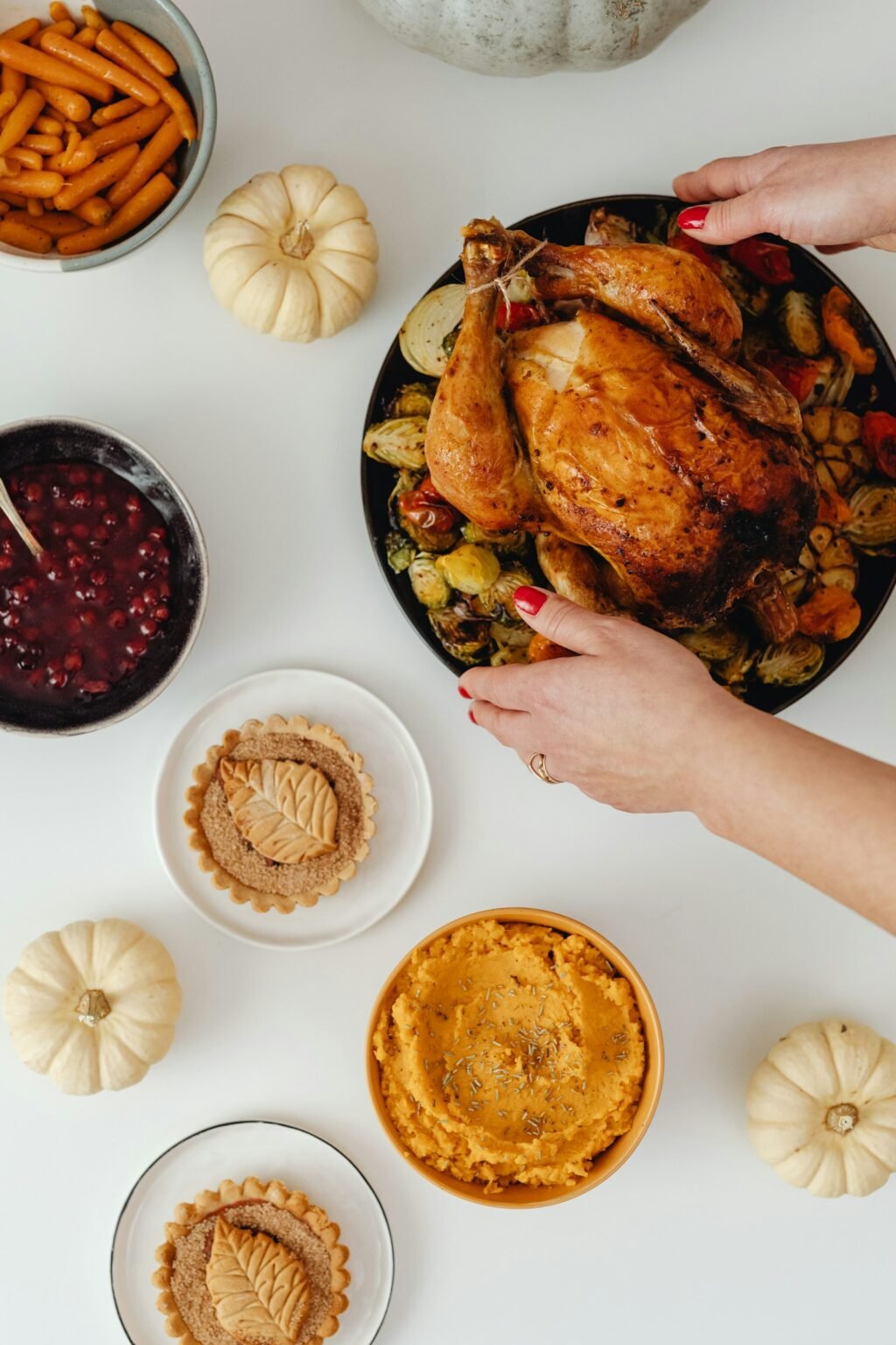 A person holding a plate of holiday food