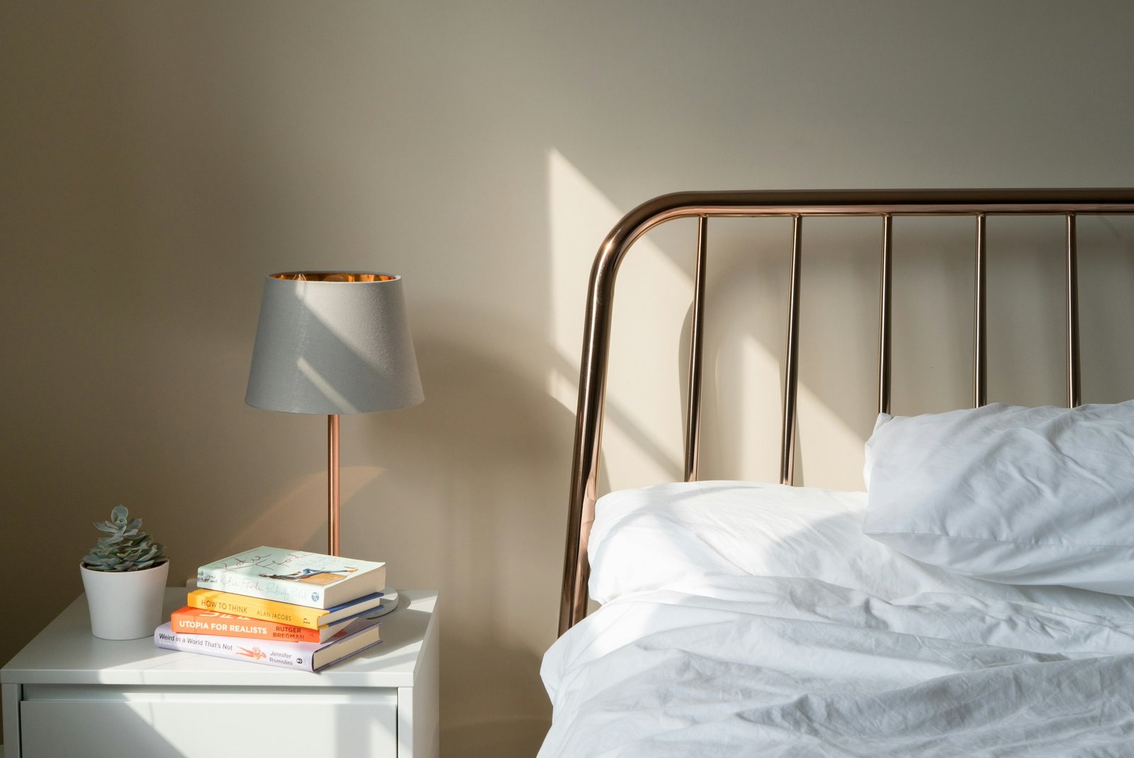 Touch bedside lamp idea: table lamp on a white wooden nightstand beside a bed