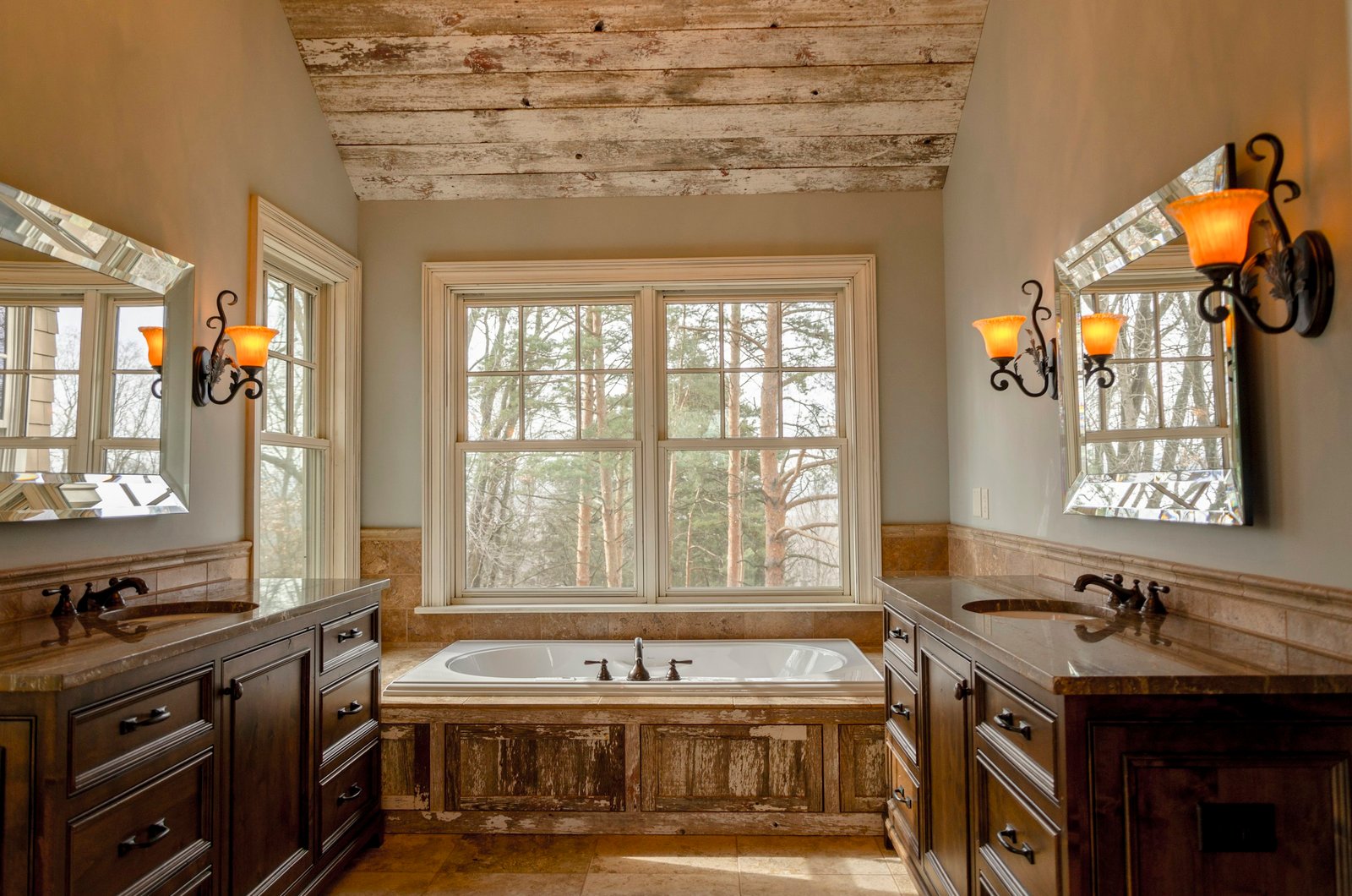 Wooden soap tray setting: bathroom with a white tub and brown wooden cabinets
